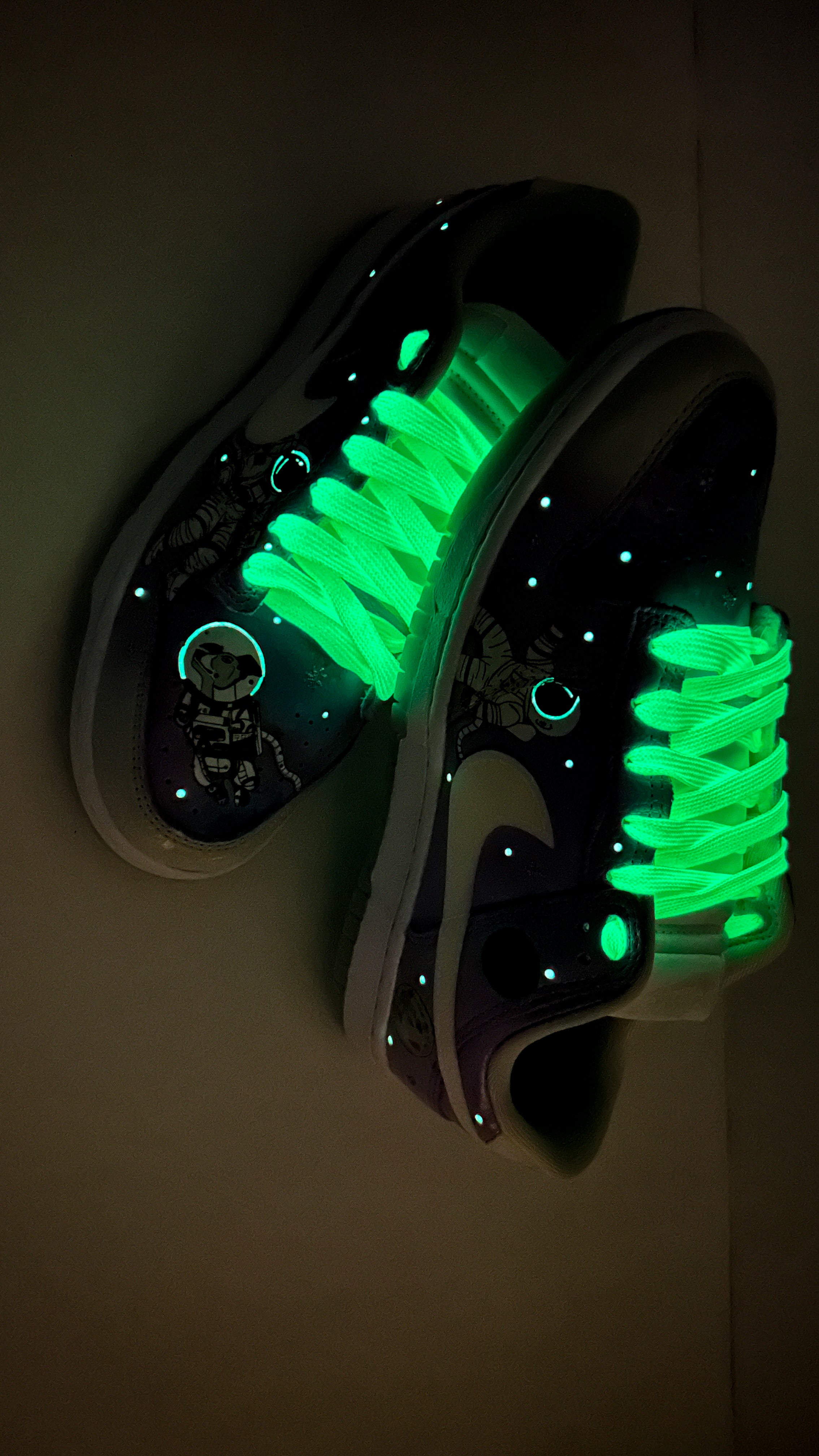 Glowing green sneakers on a dark background