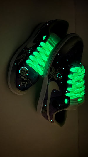 Glowing green sneakers on a dark background